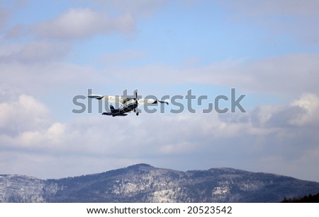 Plane with Sky Divers Aboard takes off from Frozen lake george, NY