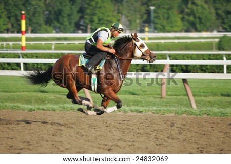 SARATOGA SPRINGS - AUGUST 12: An unidentified Rider Breezes a Horse on the Saratoga Main Track on August 12, 2005 in Saratoga Springs, NY.