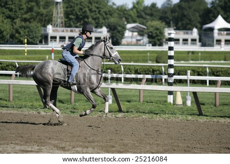SARATOGA SPRINGS - August 12: Rider Amy Labarron Gallops a Horse in the Morning on the Main Track on August 12, 2006 in Saratoga Springs, NY.
