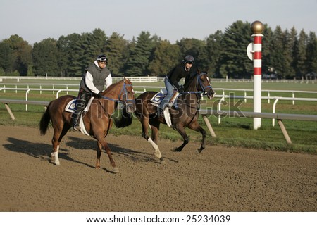 SARATOGA SPRINGS - September 22: Two Rider Work Horses for Trainer H. James Bond in the Morning on the Oklahoma Training Track on September 22, 2006 in Saratoga Springs, NY.