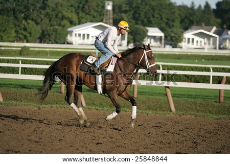 SARATOGA SPRINGS - September 4: An Unknown Rider Works a Horse in the Morning on the Saratoga Main Track on September 4, 2005 in Saratoga Springs, NY.