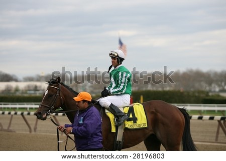 OZONE PARK - APR 4: Javier Castellano aboard Capt. Candyman Can returns to the winners circle after the 49th Running of the Bay Shore Grade III at Aqueduct Race Track- April 4, 2008 in Ozone Park, NY.
