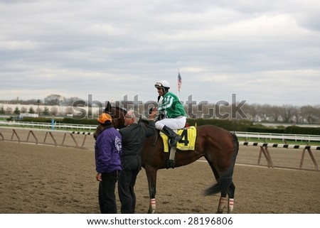 OZONE PARK - APR 4: Javier Castellano aboard Capt. Candyman Can returns to the winners circle after the 49th Running of the Bay Shore Grade III at Aqueduct Race Track- April 4, 2008 in Ozone Park, NY.