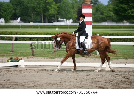 SARATOGA SPRINGS - MAY 23: Gail Kapiloff competes on Ghinger-Ale the Open Division at the Dressage May 23, 2009 in Saratoga Springs, NY.