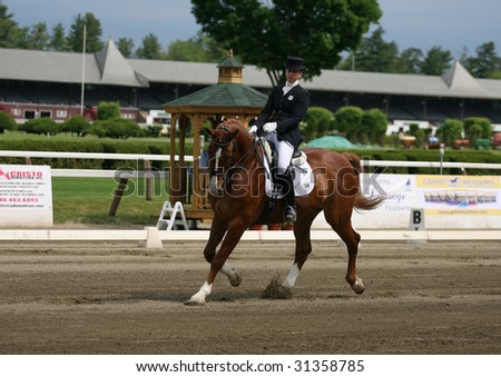 SARATOGA SPRINGS - MAY 23: Stephanie Nowak competes on Coriall the Junior Division at the Dressage May 23, 2009 in Saratoga Springs, NY.