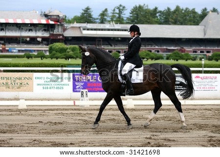 SARATOGA SPRINGS - MAY 23: Susan Niblo competes on Pjotr in the Aduklt Amateur Division at the Dressage May 23, 2009 in Saratoga Springs, NY.