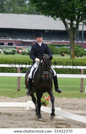 SARATOGA SPRINGS - MAY 23: Harry Diel competes on Carry On F. Gamdaard in Adult Amateur Division at the Dressage May 23, 2009 in Saratoga Springs, NY.