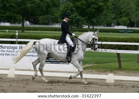 SARATOGA SPRINGS - MAY 23: Mary Bahniuk Lauritsen competes on ToyBoy in Junior Division at the Dressage May 23, 2009 in Saratoga Springs, NY.
