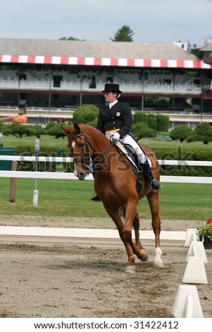 SARATOGA SPRINGS - MAY 23: Alexa Rice competes on Maarten in Junior Division at the Dressage May 23, 2009 in Saratoga Springs, NY.