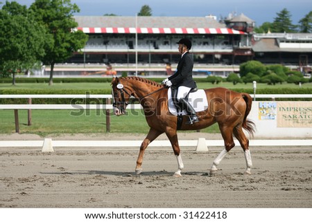SARATOGA SPRINGS - MAY 23: Gail Kapiloof competes on Ghinger-Ale in the Open Division at the Dressage May 23, 2009 in Saratoga Springs, NY.
