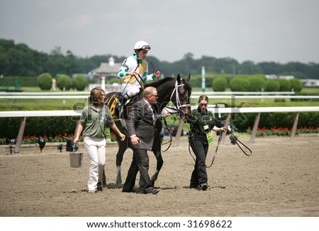 ELMONT - JUNE 6: Fabulous Strike with Ramon Dominguez aboard entering the winners circle after The True North Grade II Stakes at Belmont Park on Belmont Stakes Day - June 6, 2009 in Elmont, NY.