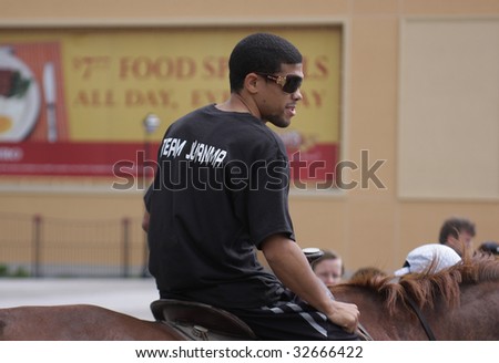 ATLANTIC CITY - JUNE 25: Juan Manuel Lopez the current WBO super bantamweight rides a horse in a promotional event on the Boardwalk at Bally\'s Casino - June 25, 2009 in Atlantic City, NJ
