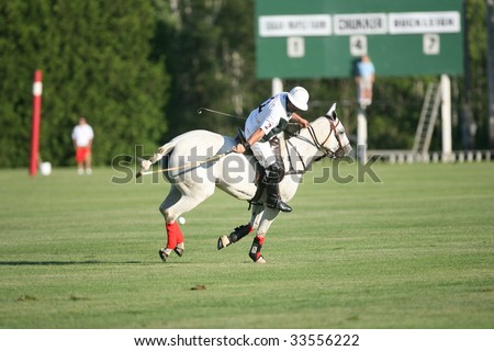 SARATOGA SPRINGS - JULY 10: Jose Rodriguez stops an attack by hitting the ball back up the field in the opening match of the season at Saratoga Polo Club July 10, 2009 in Saratoga Springs, NY.