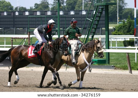 ELMONT, NY- JULY 25: Michael Luzzi abord Chernobyl\'s Hero in the post parade for the third race at Belmont Park- July 25, 2009 in Elmont, NY.