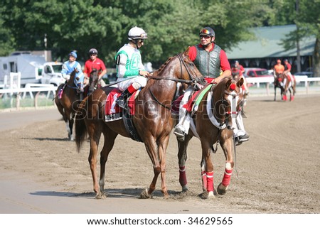 SARATOGA SPRINGS, NY- AUGUST 1:  John Velazquez (L) aboard Vivi\'s Book in the post parade for the Lake Luzerne Stakes at Saratoga Race Track August 1, 2009 in Saratoga Springs, NY.