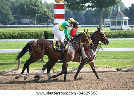 SARATOGA SPRINGS, NY- AUGUST 1:  John-Luc Samyn (L) aboard Yet Again in the post parade for the Lake Luzerne Stakes at Saratoga Race Track August 1, 2009 in Saratoga Springs, NY.