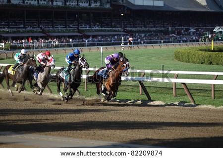 SARATOGA SPRINGS - JULY 23: Plum Pretty leads It\'s Tricky in the Grade 1 Coaches Club American Oaks Stakes July 23, 2011 in Saratoga Springs, NY.