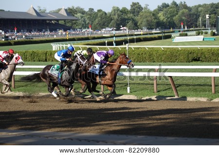 SARATOGA SPRINGS - JULY 23: Plum Pretty leads It's Tricky in the Grade 1 Coaches Club American Oaks Stakes July 23, 2011 in Saratoga Springs, NY.