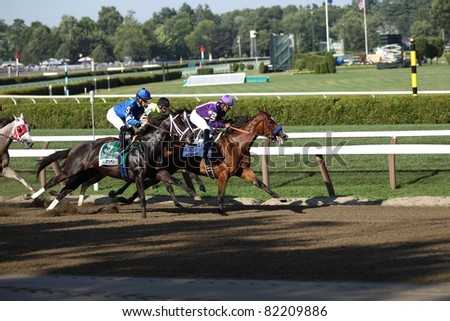 SARATOGA SPRINGS - JULY 23: Plum Pretty leads It's Tricky in the Grade 1 Coaches Club American Oaks Stakes July 23, 2011 in Saratoga Springs, NY.