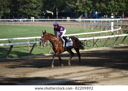 SARATOGA SPRINGS - JULY 23: It\'s Tricky returns to the winners circle after winning the Grade 1 Coaches Club American Oaks Stakes July 23, 2011 in Saratoga Springs, NY.