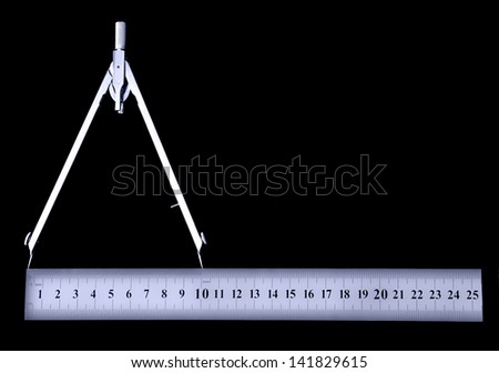 Precision compass and ruler on black background