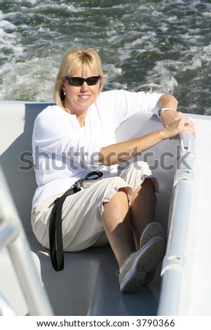 An attractive middle age lady out for a day on the water.