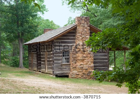 A log cabin in the woods.