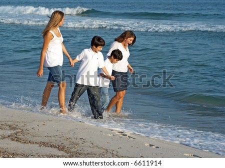 A family walking together on the Alabama gulf coast.