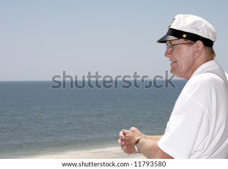 An old man looking out at the sea.