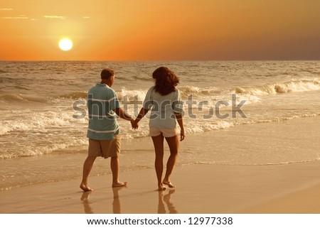 A couple walking together on the Alabama Gulf Coast.