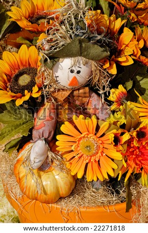 A scarecrow decoration for the fall season.