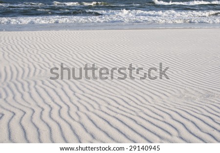 Wind blown pattern in the sand of the beach at Gulf Shores Alabama.