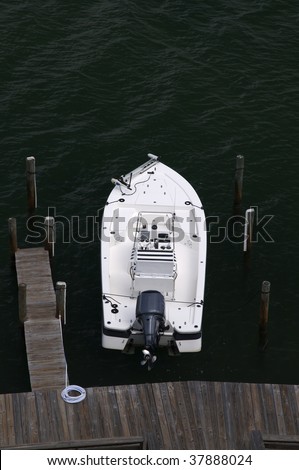 An overhead view of a fishing boat at the dock.