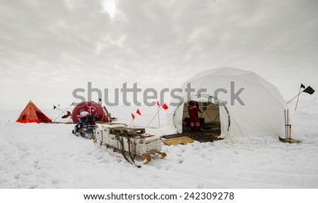 Polar research dive camp over a drifting ice floe in Antarctica