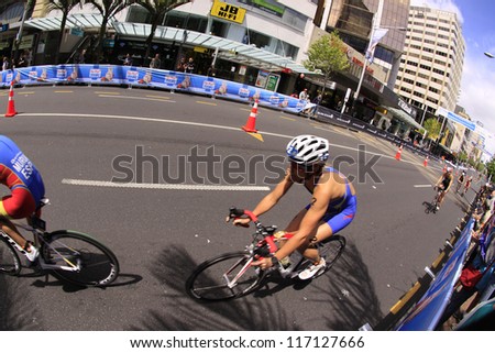 AUCKLAND-OCT. 20: Women participants in the ITU World Triathlon Grand Final Series cycle the main street of downtown Auckland. on Saturday, Oct. 20, 2012.