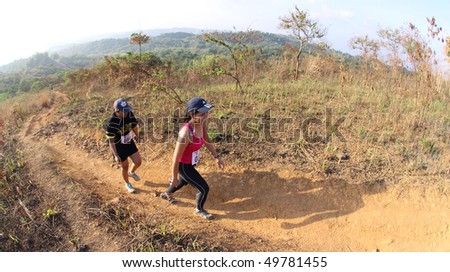 MANILA - MARCH 28: Participants of the 4th All Terra King of the Mountain at the Timberland Heights which is a 10-kilometer trail run and 20-kilometer mountain bike race on March 28, 2010 in Manila. race.