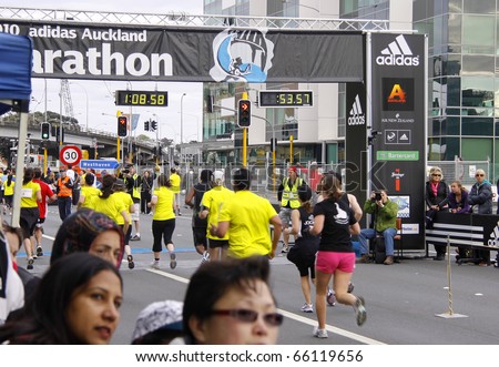 AUCKLAND - OCTOBER 31: Participants in the Adidas Auckland marathon run sprint to the finish line on sunday Oct. 31,2010 at  Auckland, New Zealand