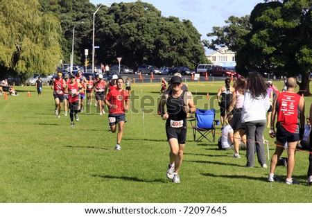 AUCKLAND- Feb. 27: Participants in the Cathay Pacific  Auckland marathon run sprint to the finish line on Sunday Feb. 27,2011 at  Orakei, Auckland, New Zealand