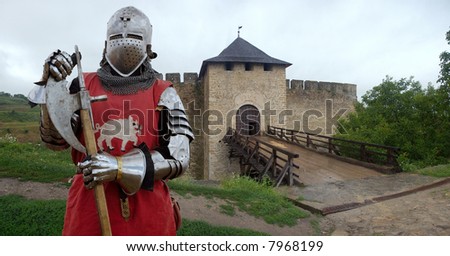 A heavy medieval knight behind the castle