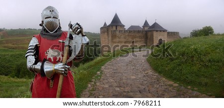 A heavy medieval knight behind the castle