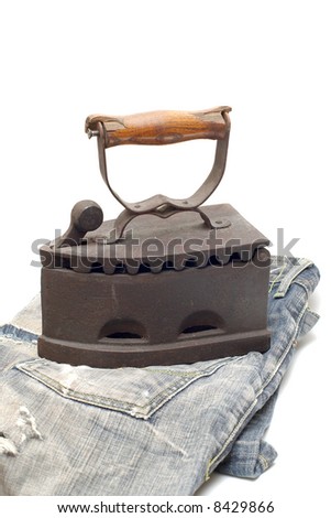 Old vintage flat-iron with jeans vertical