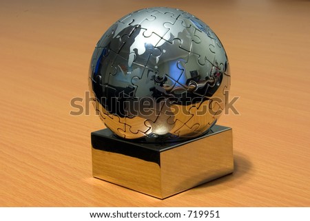 Iron globe puzzle on the desk