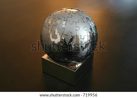 Iron globe puzzle on the desk