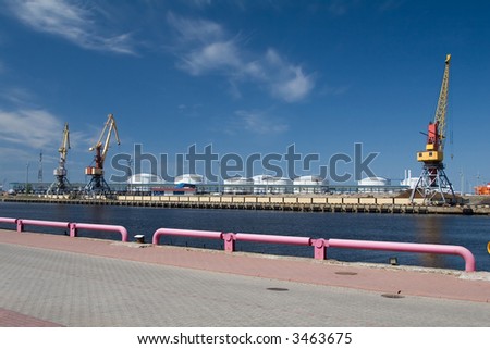 Sea port, blue skyes, port lifting crane