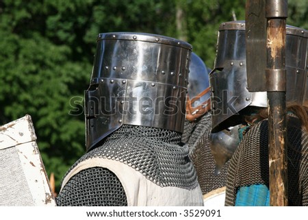 Two medieval knights in helmets