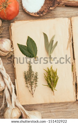 Herbs on vintage cook book