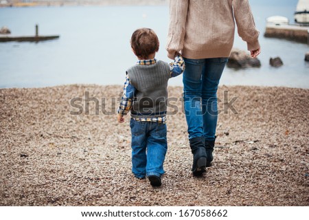 Mother And Her Son By The Sea