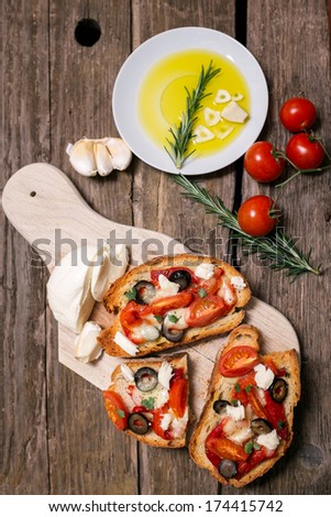 Bruschetta with tomatoes, pepper, mozzarella and garlic