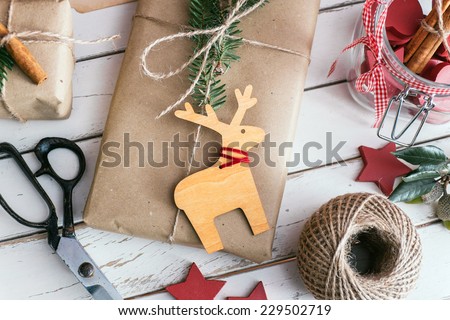 Homemade wrapped christmas presents with tools and decorations