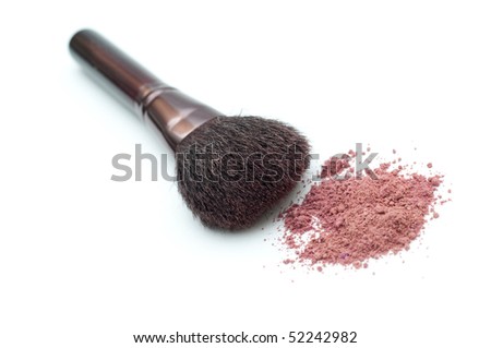 Makeup brush with powder isolated on white.